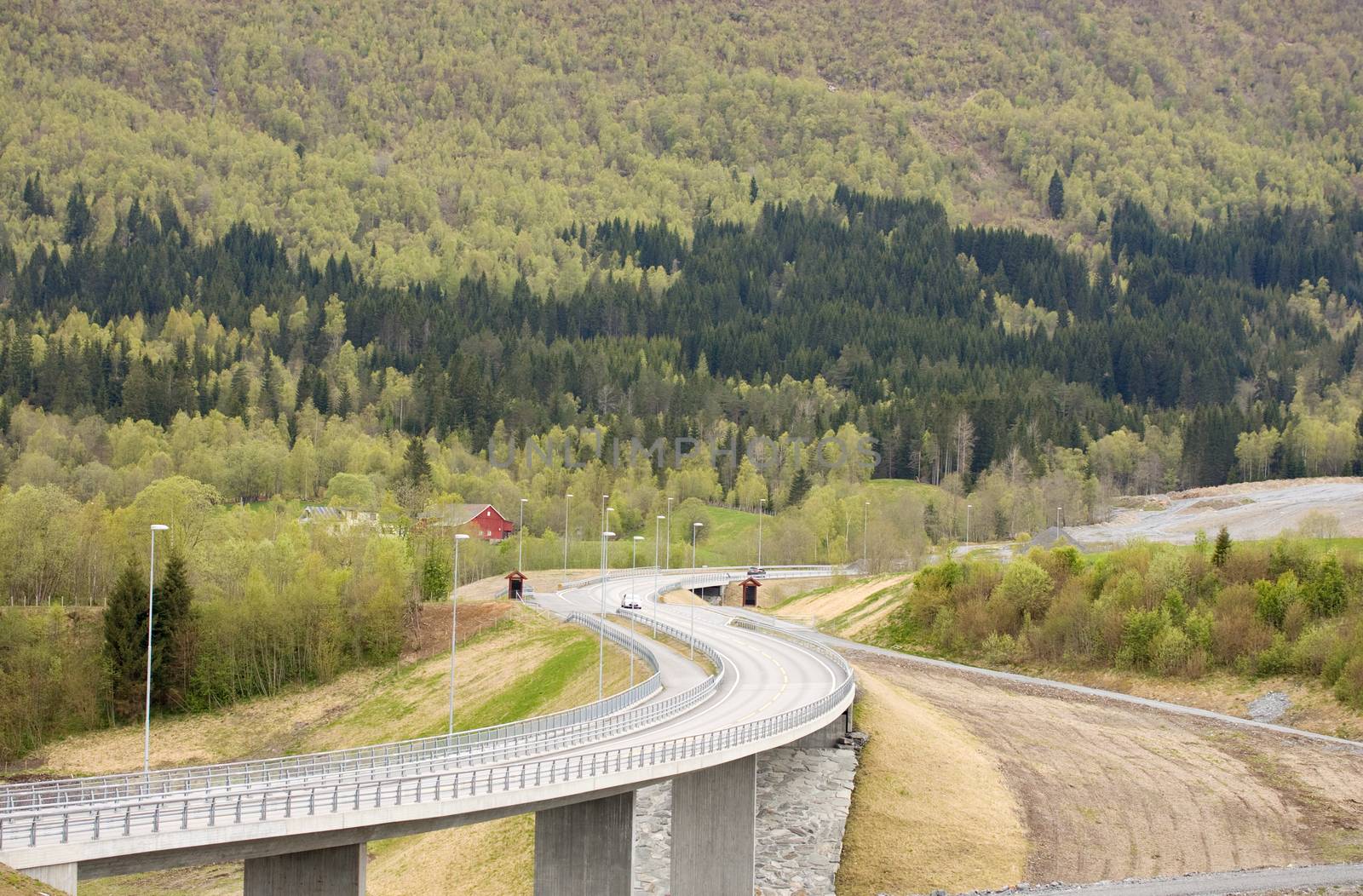 Curvy road with bridge in rural landscape