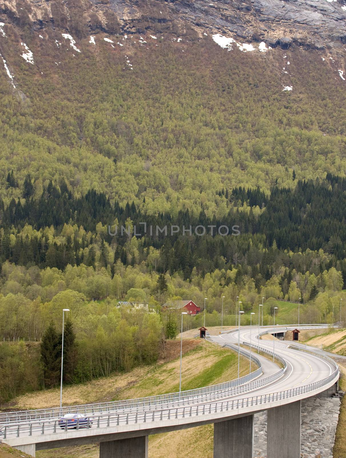 Curvy road with bridge in rural landscape