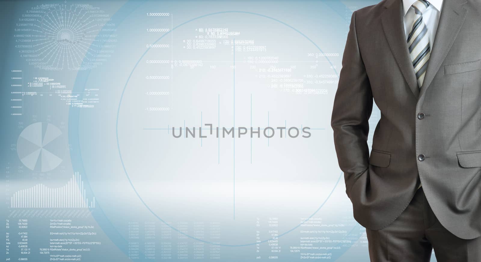 Businessman standing with hands in pockets. High-tech graphs at backdrop
