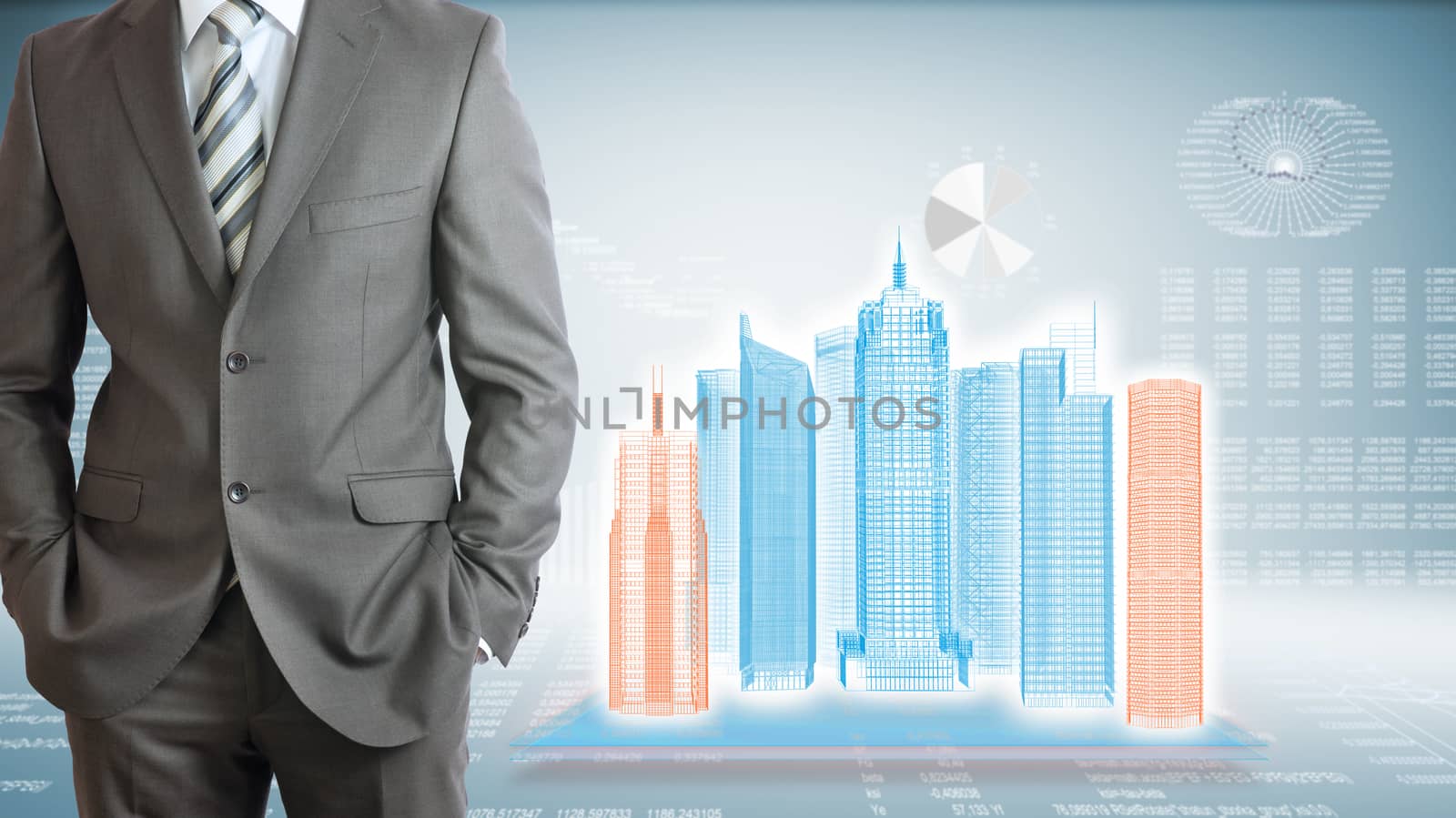 Businessman with high-tech skyscrapers and graphs by cherezoff