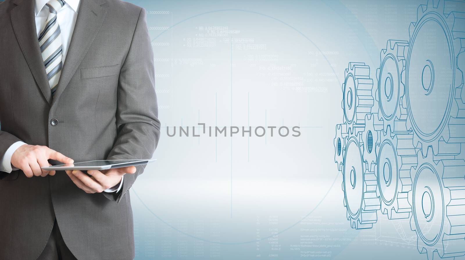 Businessman hold tablet pc. High-tech wire frame gears and graphs at backdrop