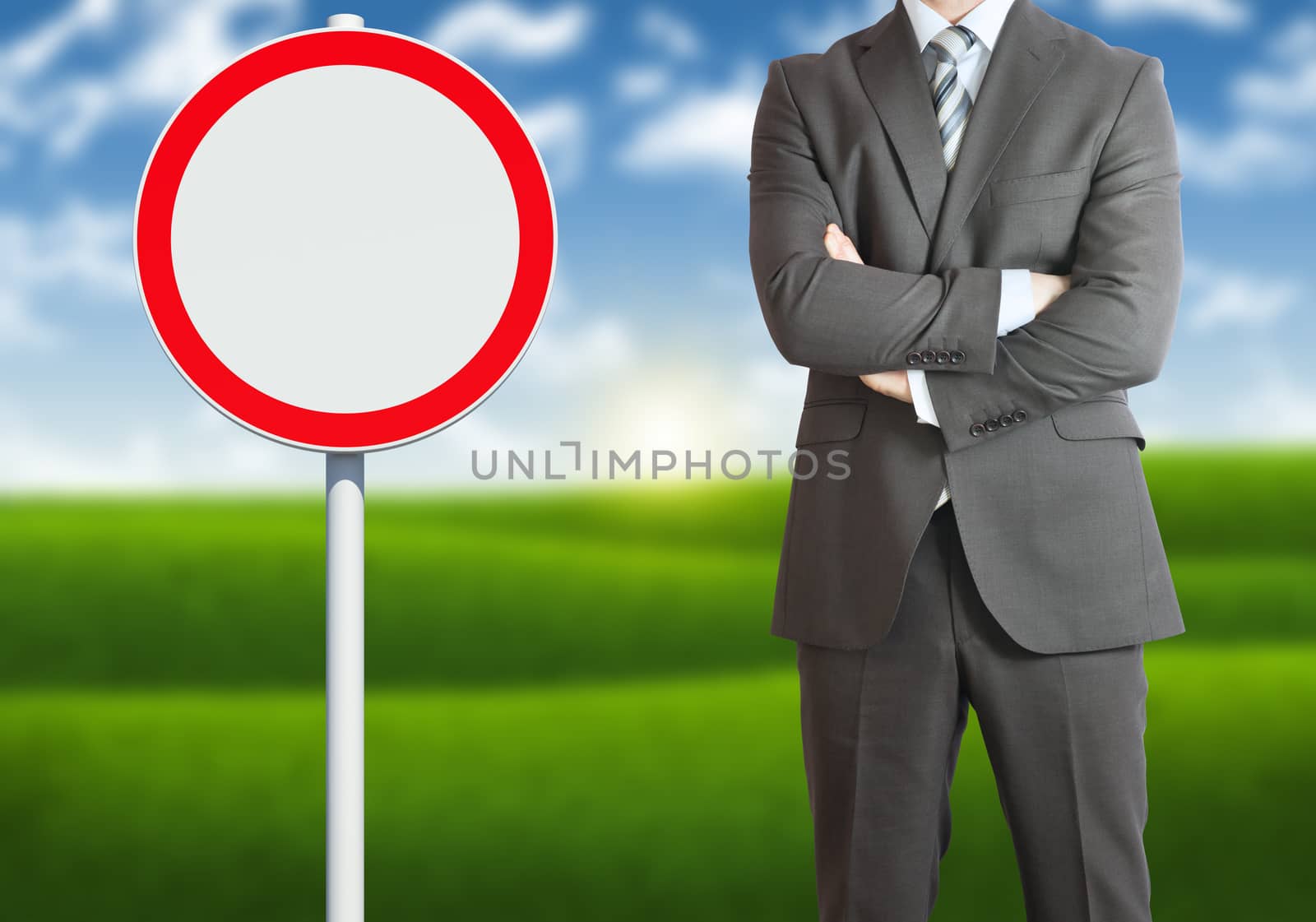 Businessman with road sign by cherezoff