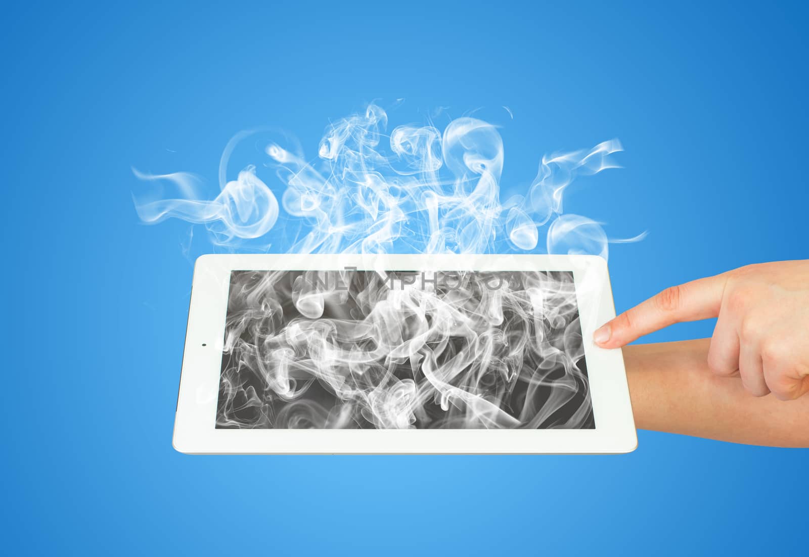 Hands holding tablet pc with white smoke by cherezoff