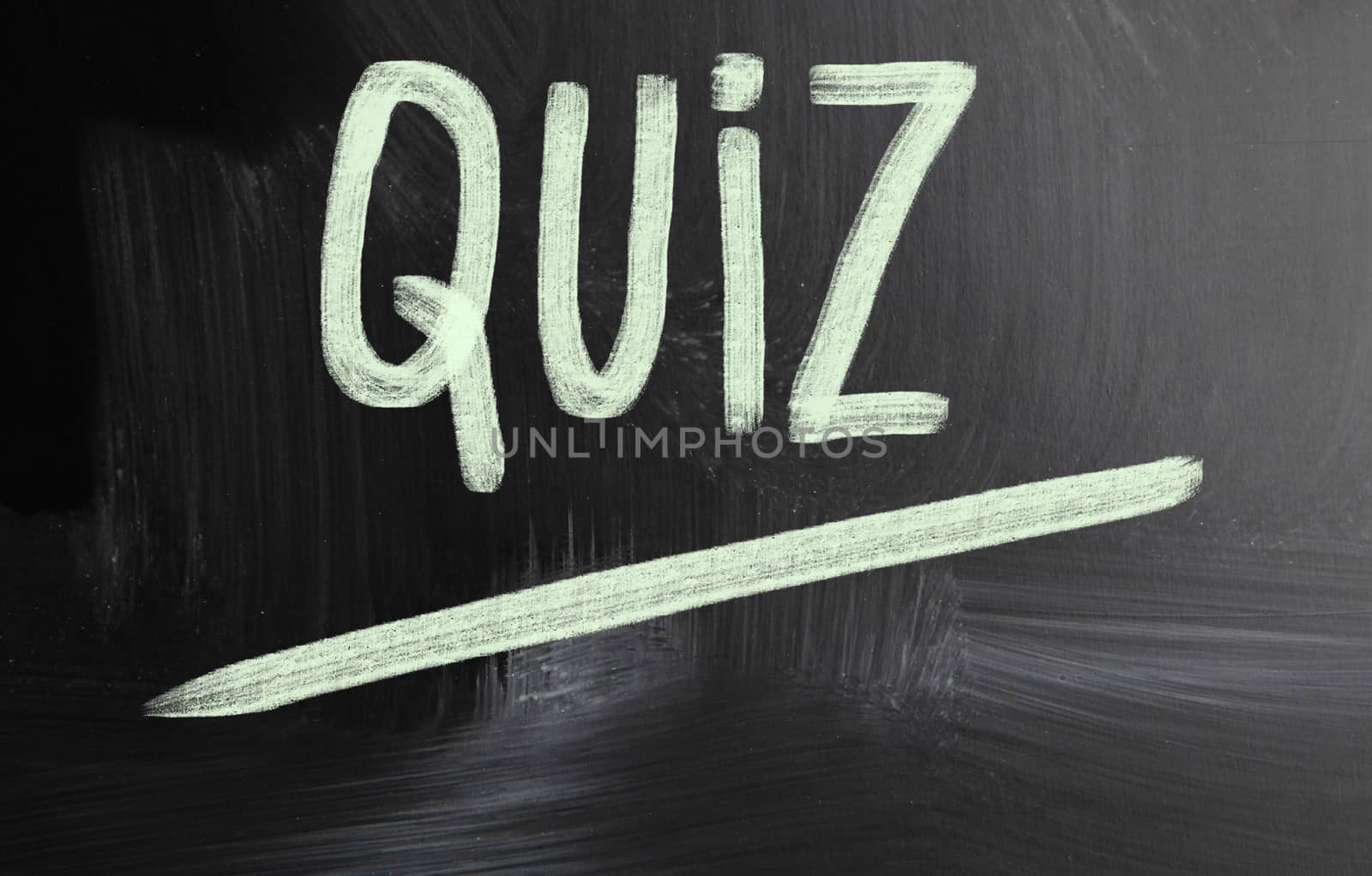 quiz handwritten with chalk on a blackboard
