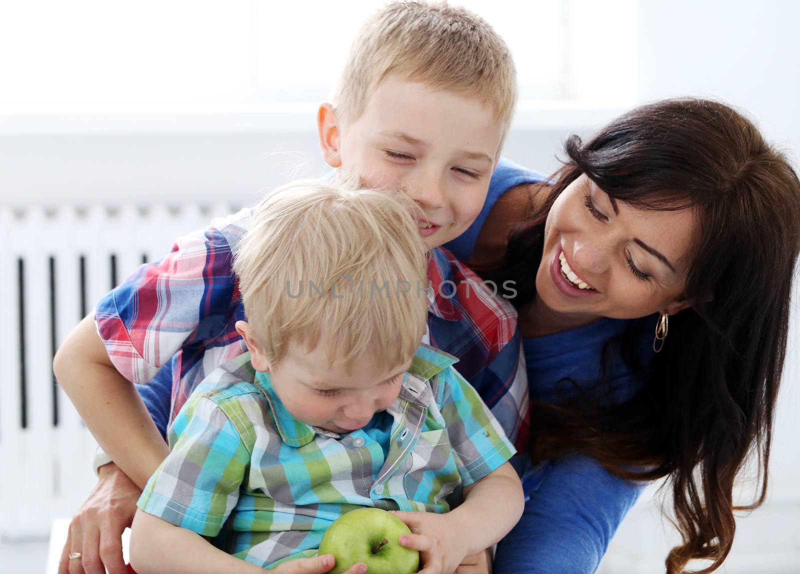 Mother and two brothers during family breakfast