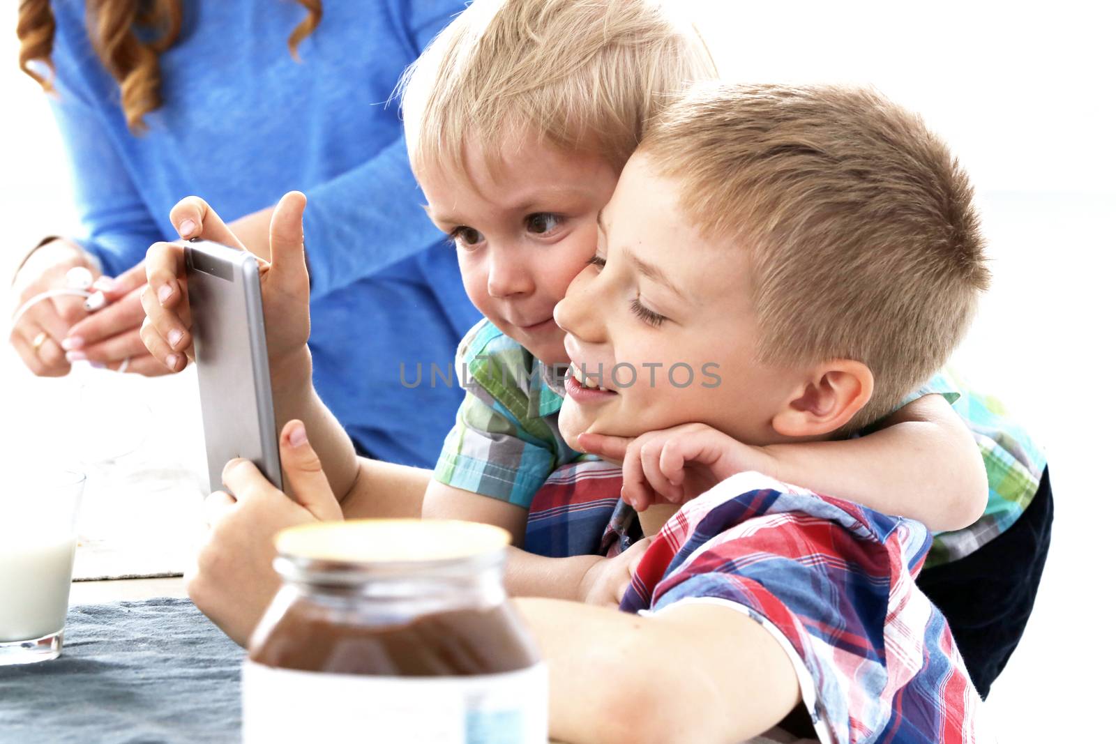 Two brothers during family breakfast