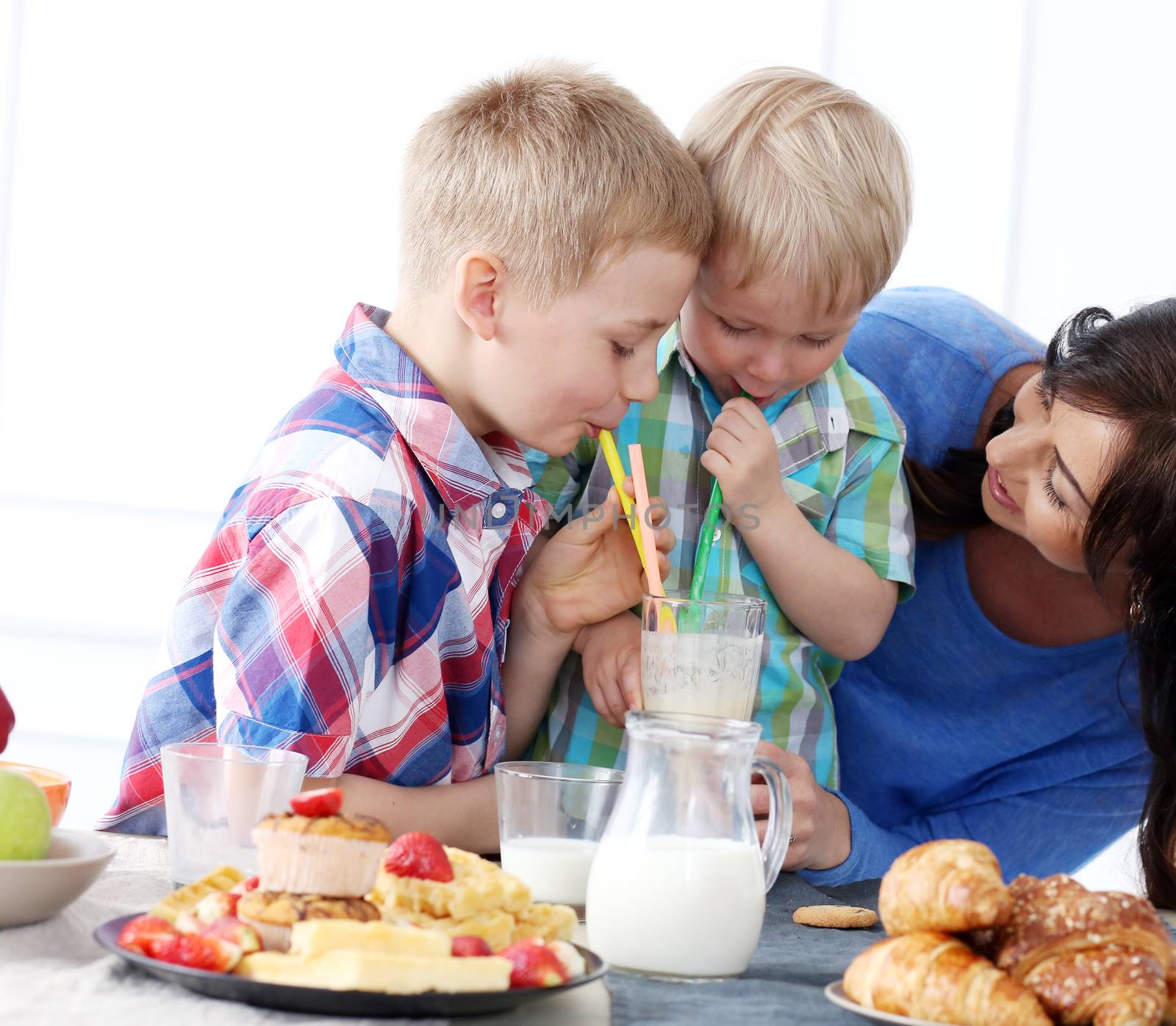 Mother and two brothers during family breakfast