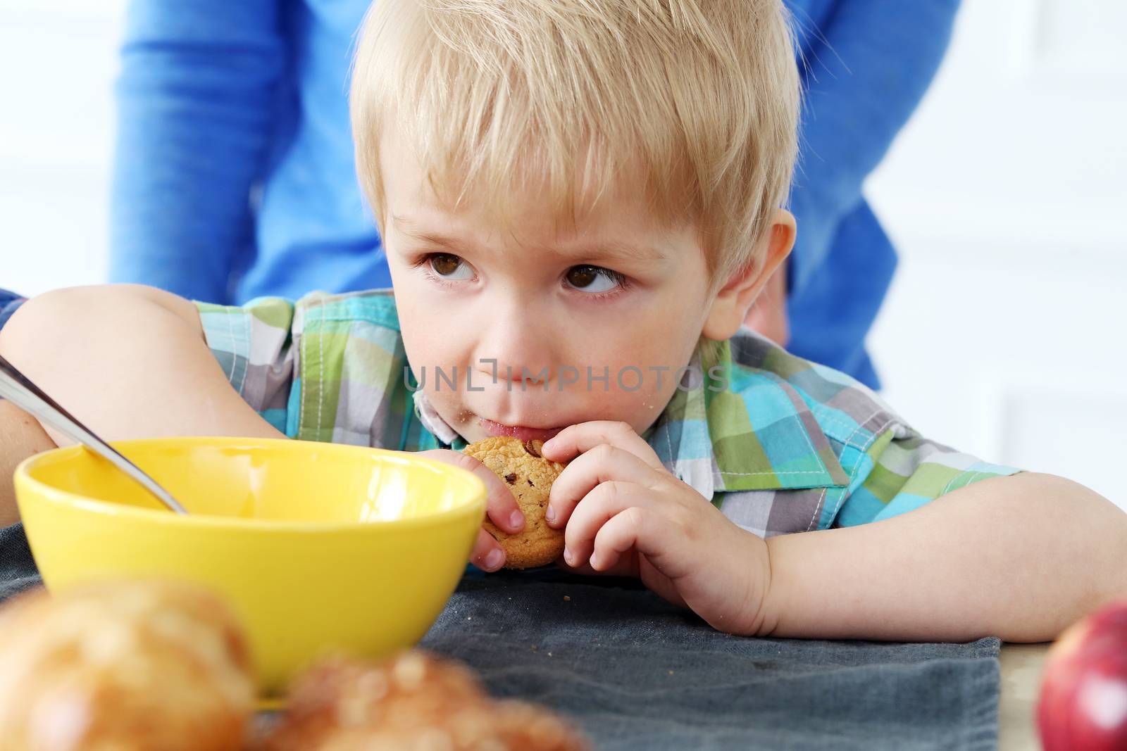 Breakfast. Young boy by the table