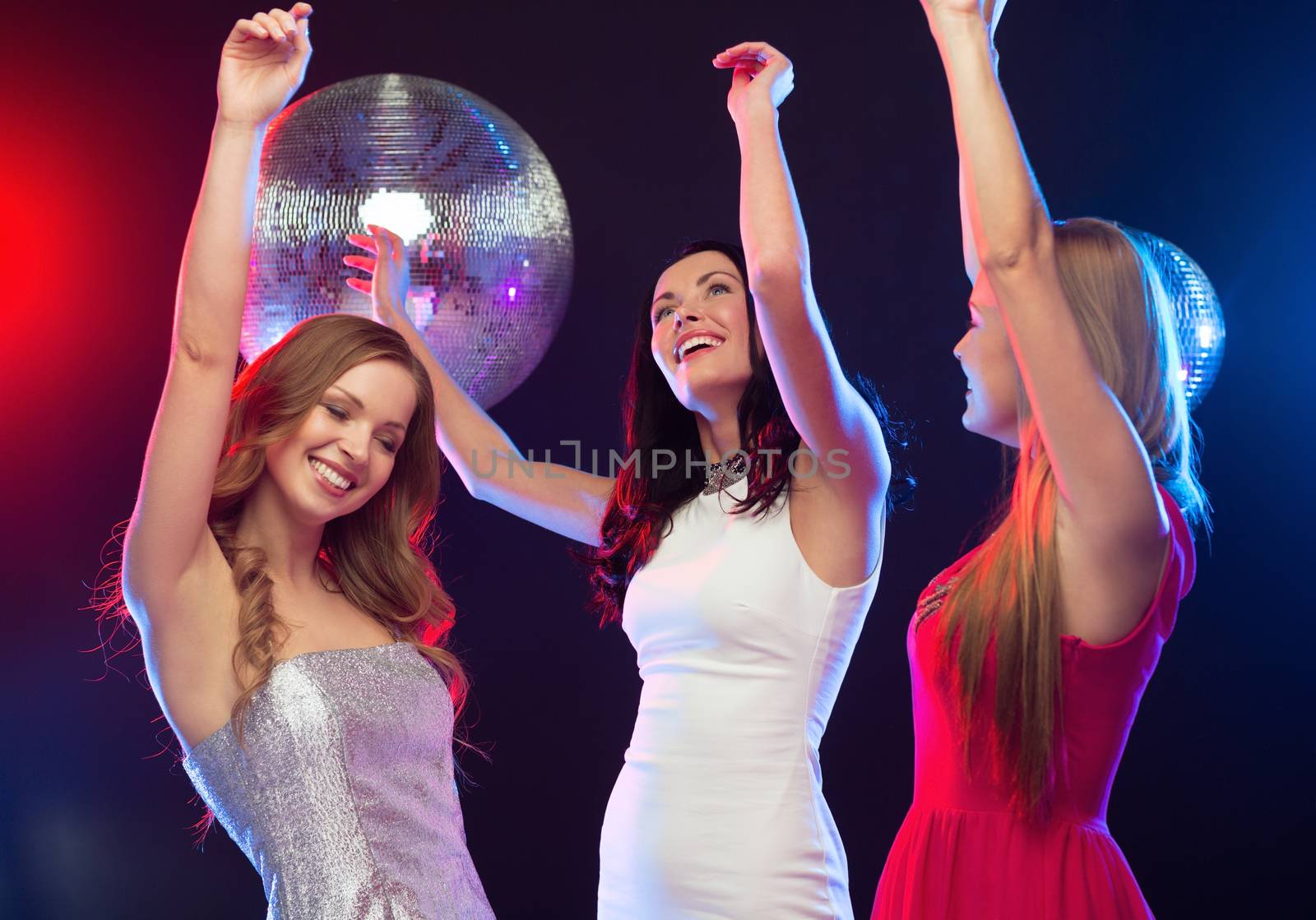 party, "new year", celebration, friends, bachelorette party, birthday concept - three beautiful woman in evening dresses dancing in the club