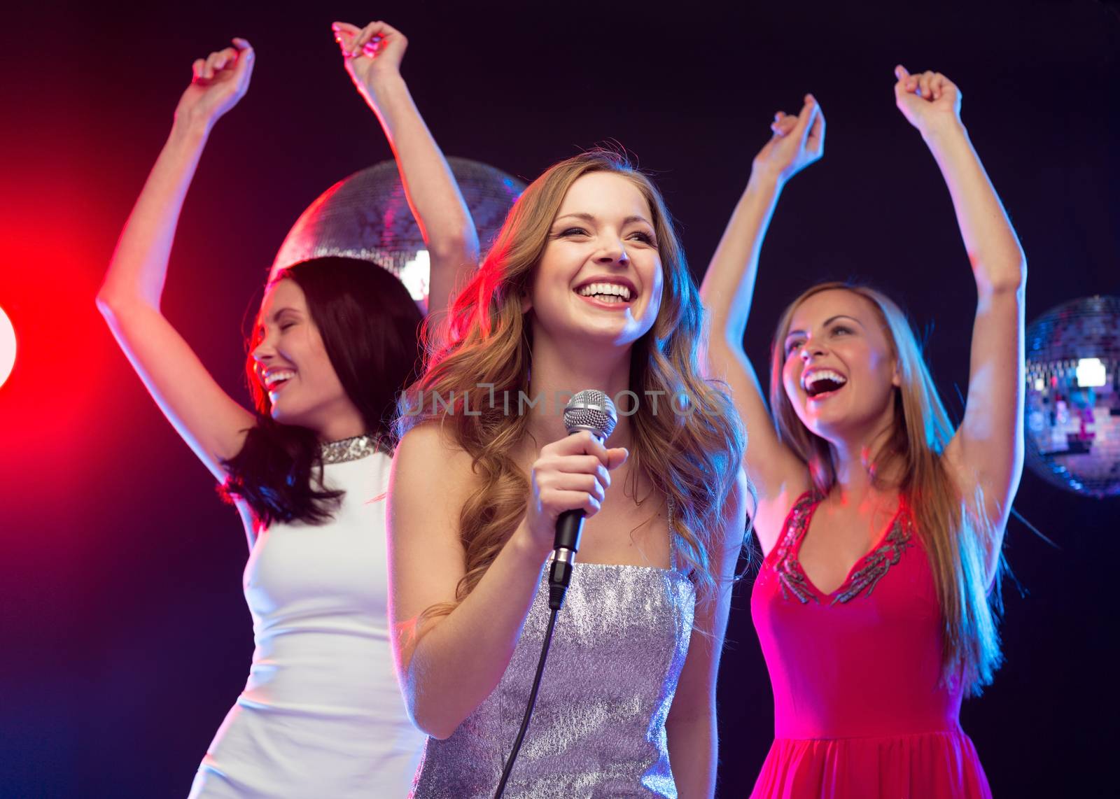 party, "new year", celebration, friends, bachelorette party, birthday concept - three women in evening dresses dancing and singing karaoke