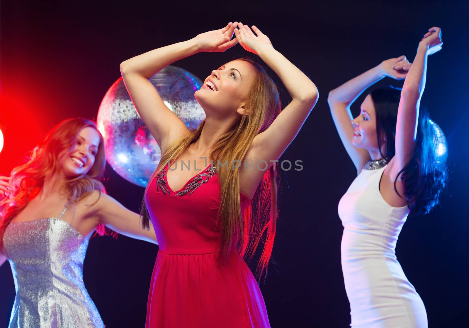 party, "new year", celebration, friends, bachelorette party, birthday concept - three beautiful women in evening dresses dancing in the club