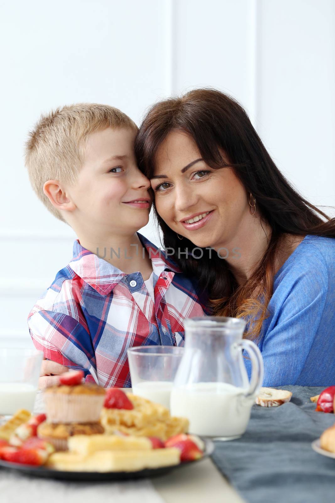 Mother with kid during family breakfast