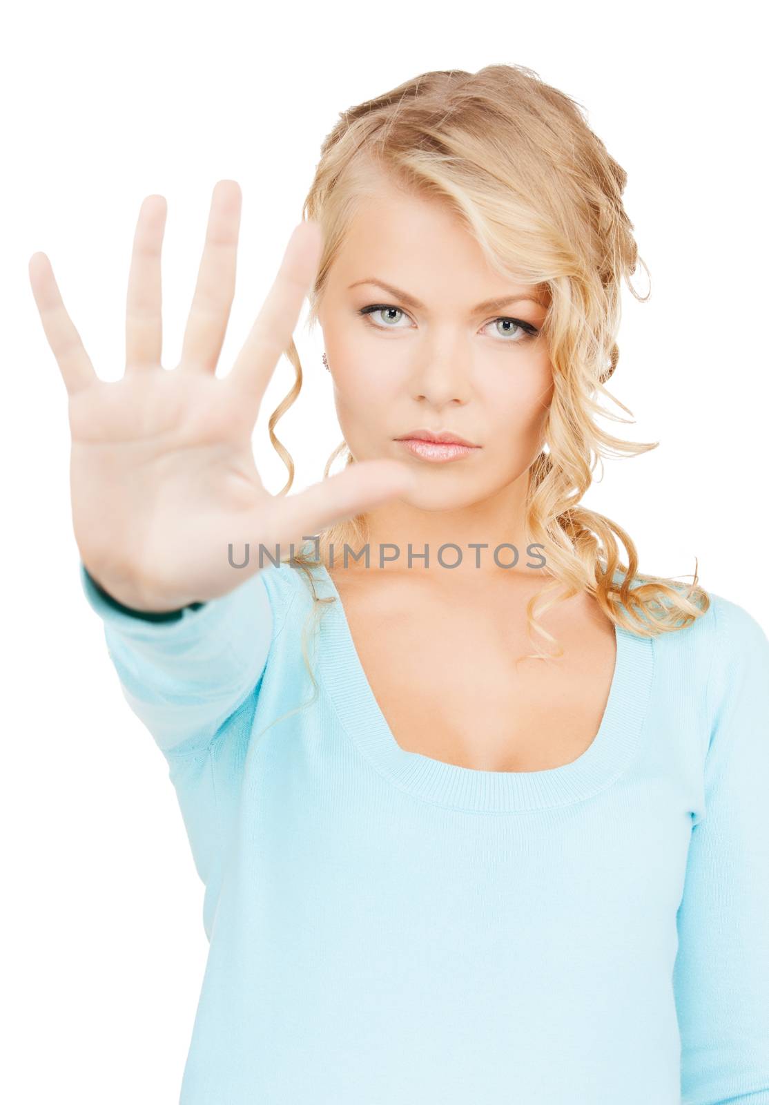business, communication concept - bright picture of young woman making stop gesture