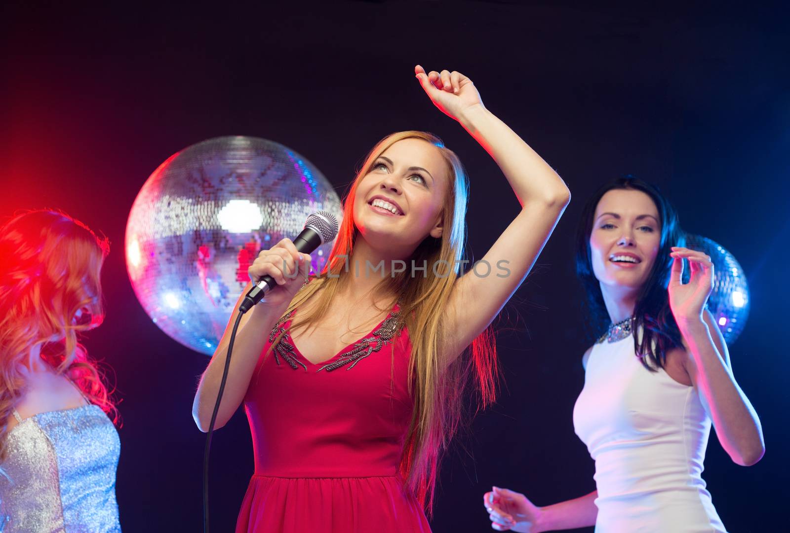 party, "new year", celebration, friends, bachelorette party, birthday concept - three women in evening dresses dancing and singing karaoke