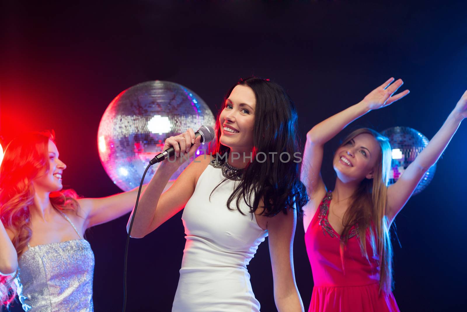 party, "new year", celebration, friends, bachelorette party, birthday concept - three women in evening dresses dancing and singing karaoke