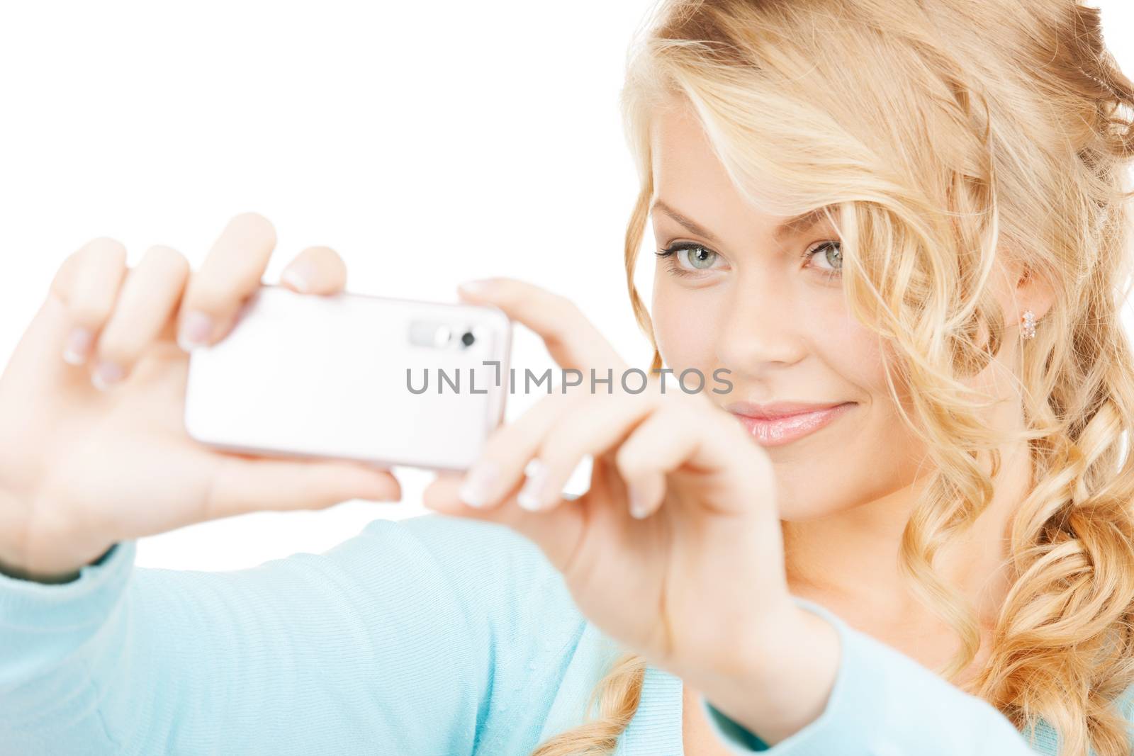 technology concept - smiling woman taking photo with smartphone