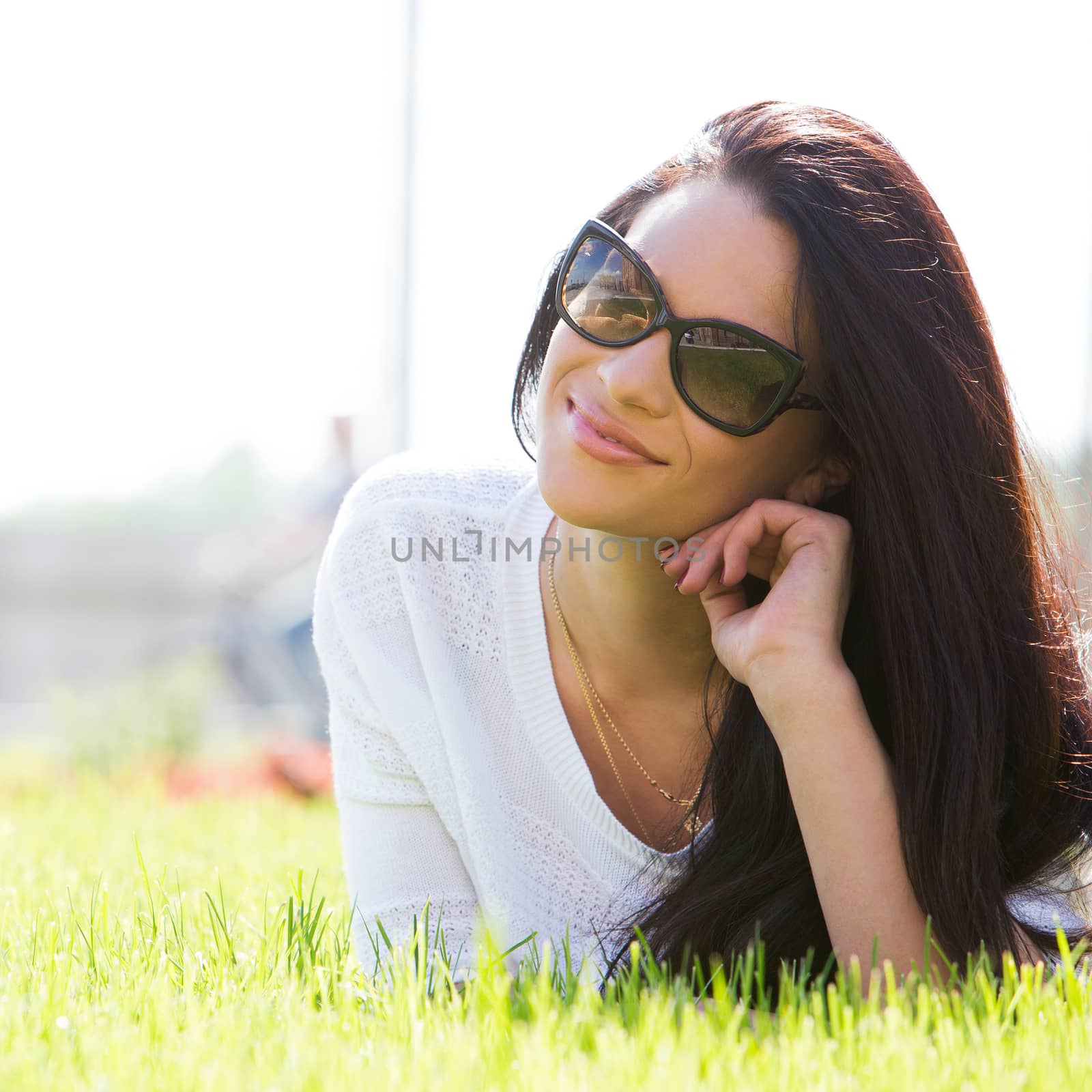 Outdoor. Cute, attractive girl on the grass