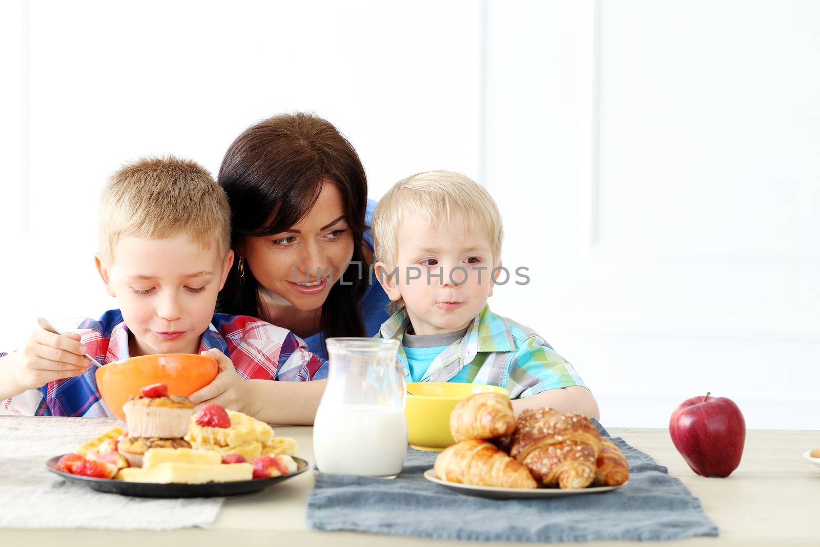 Mother and two brothers during family breakfast