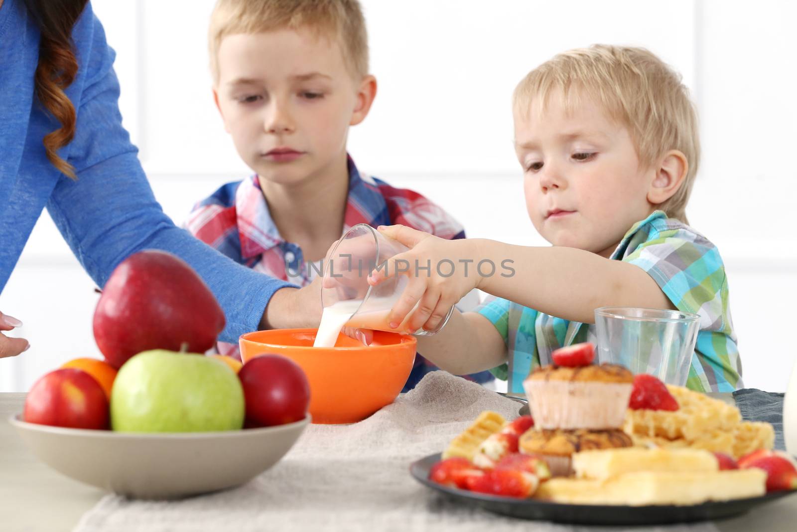 Mother and two brothers during family breakfast