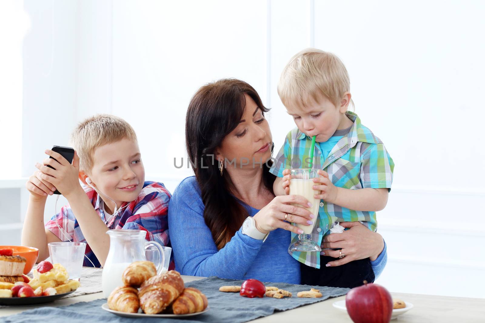 Mother and two brothers during family breakfast