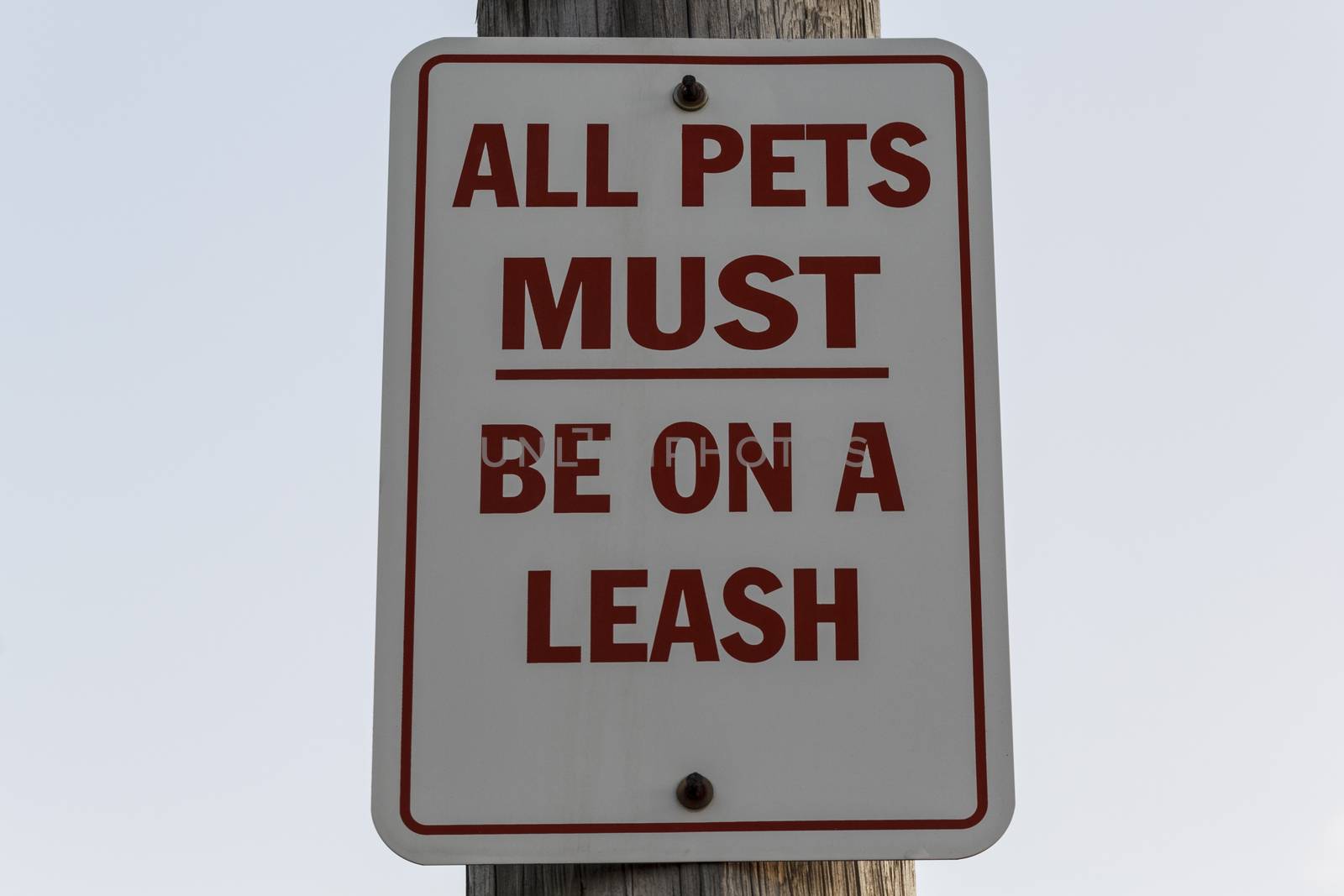 All pets must be on a leash red and white sign. 