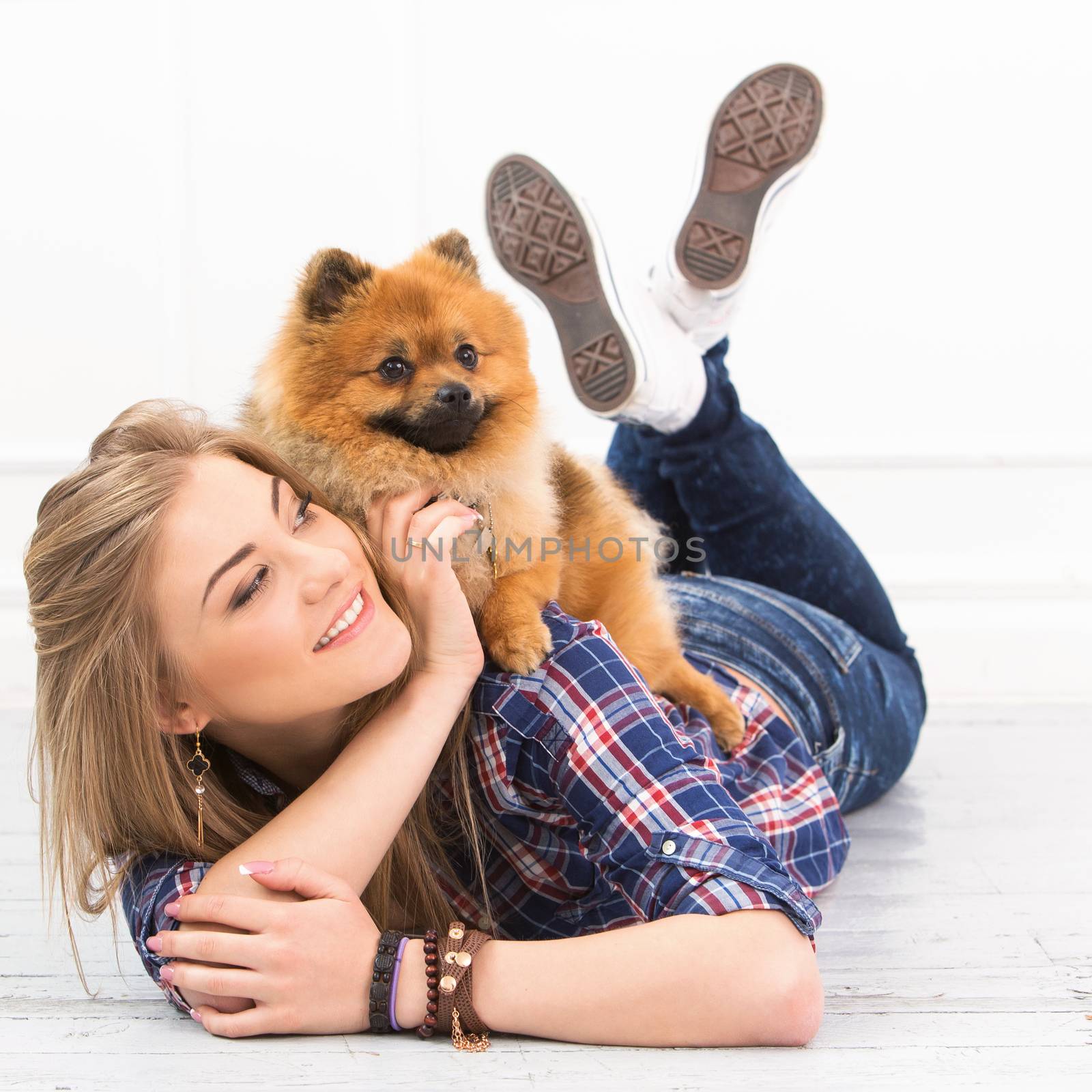 Cute, attractive girl with fluffy dog