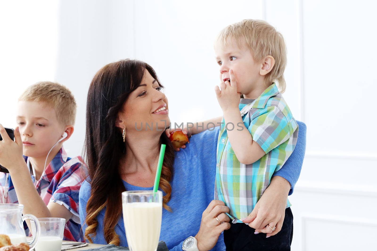 Mother and two brothers during family breakfast