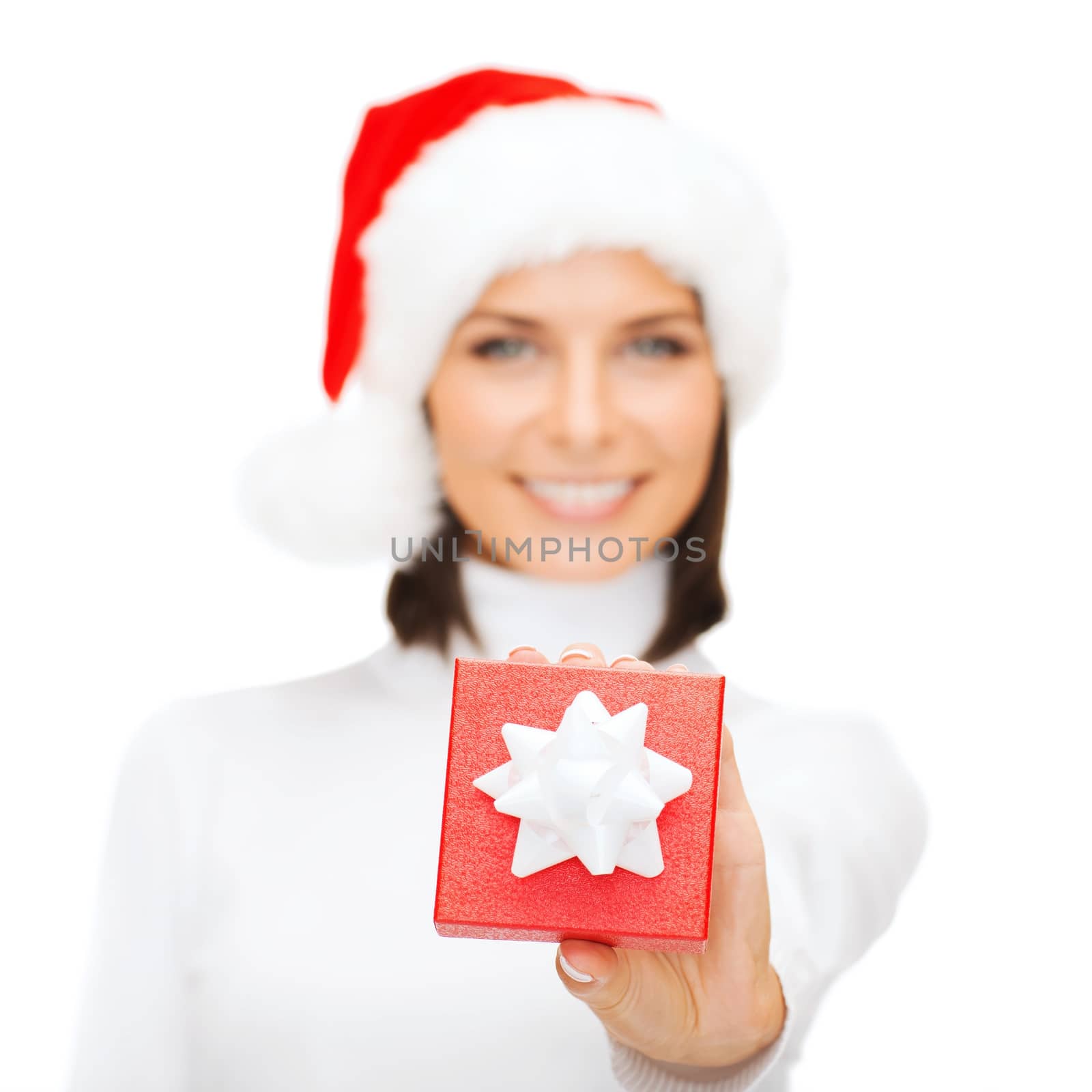 woman in santa helper hat with small gift box by dolgachov