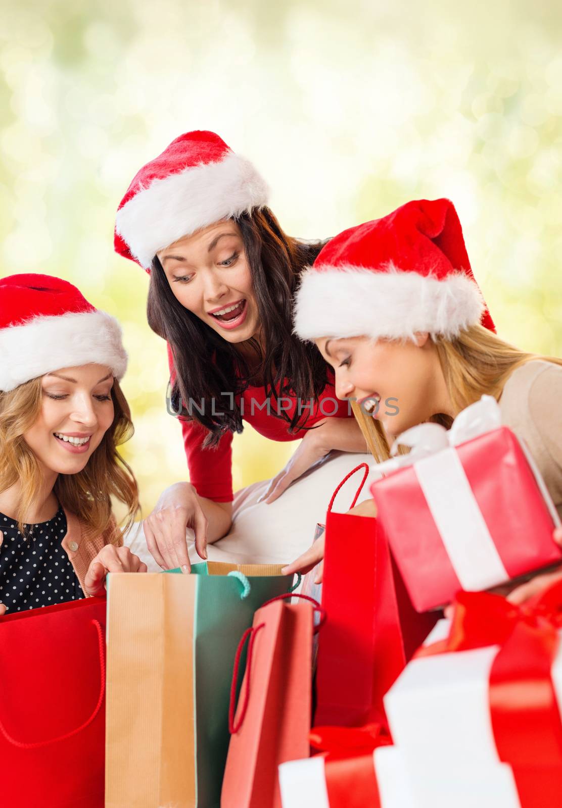 shopping, sale, gifts, christmas, x-mas concept - smiling women in santa helper hats with shopping bags and many gift boxes