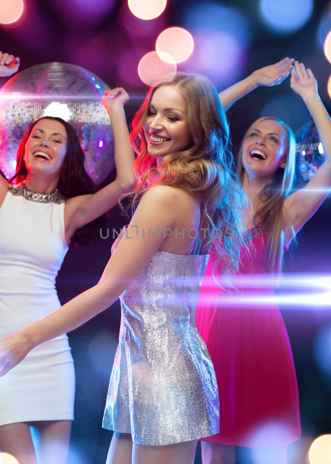 party, new year, celebration, friends, bachelorette party, birthday concept - three beautiful woman in evening dresses dancing in the club