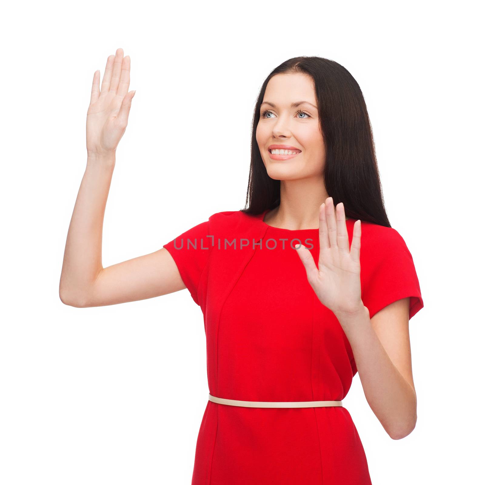 technology concept - attractive young woman in red dress working with virtual screen