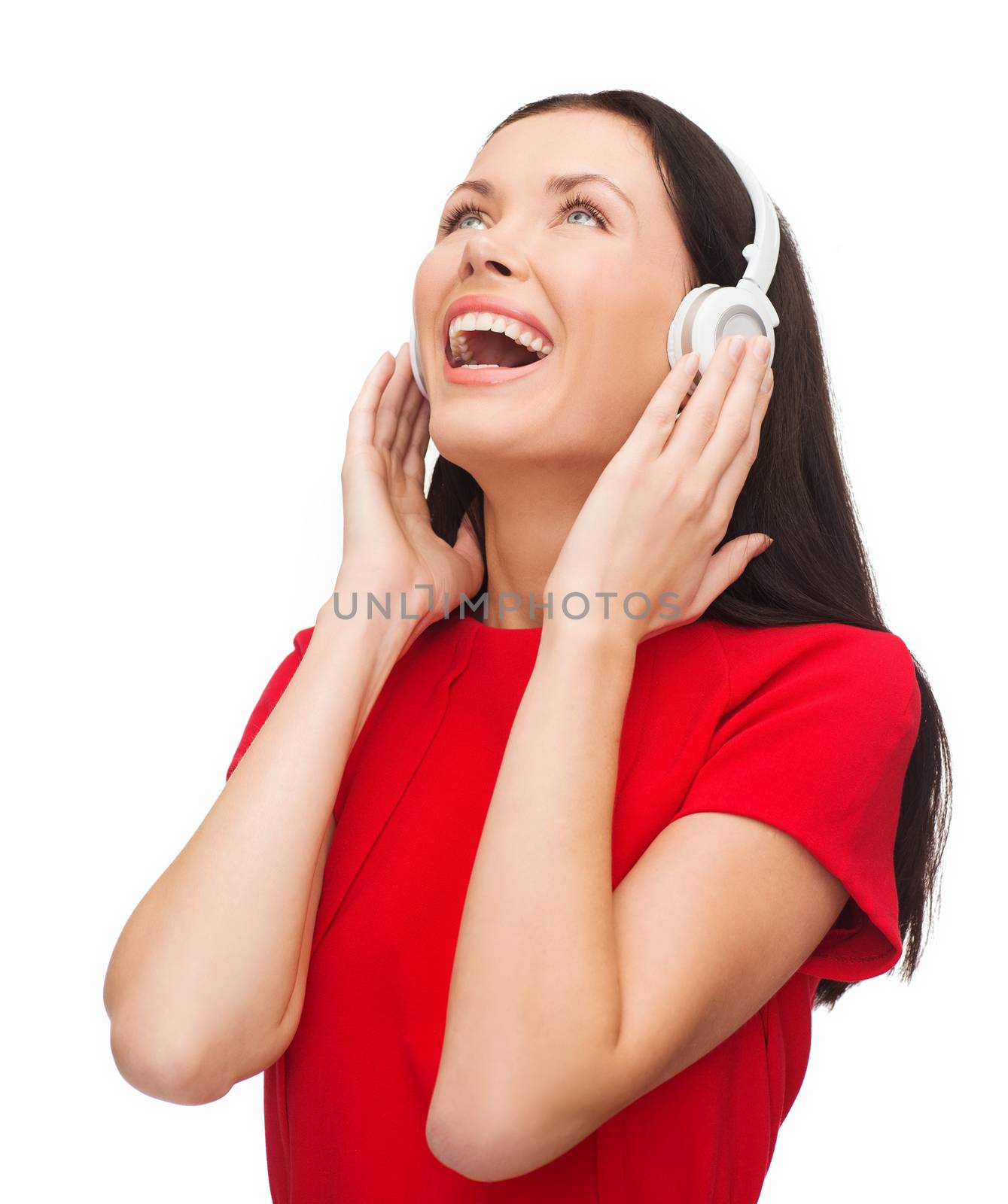 music and technology concept - laughing young woman with headphones
