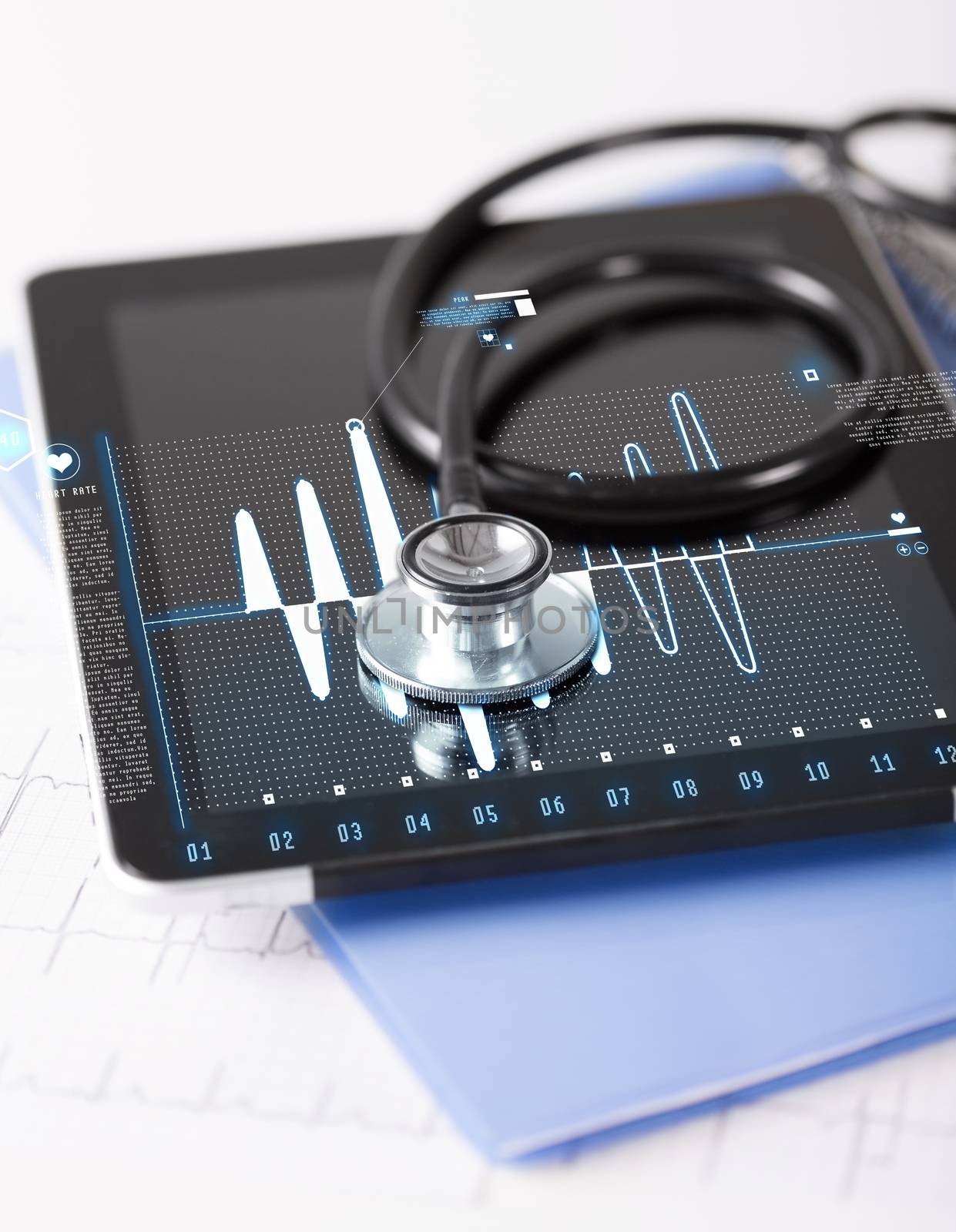 tablet pc, stethoscope and electrocardiogram by dolgachov