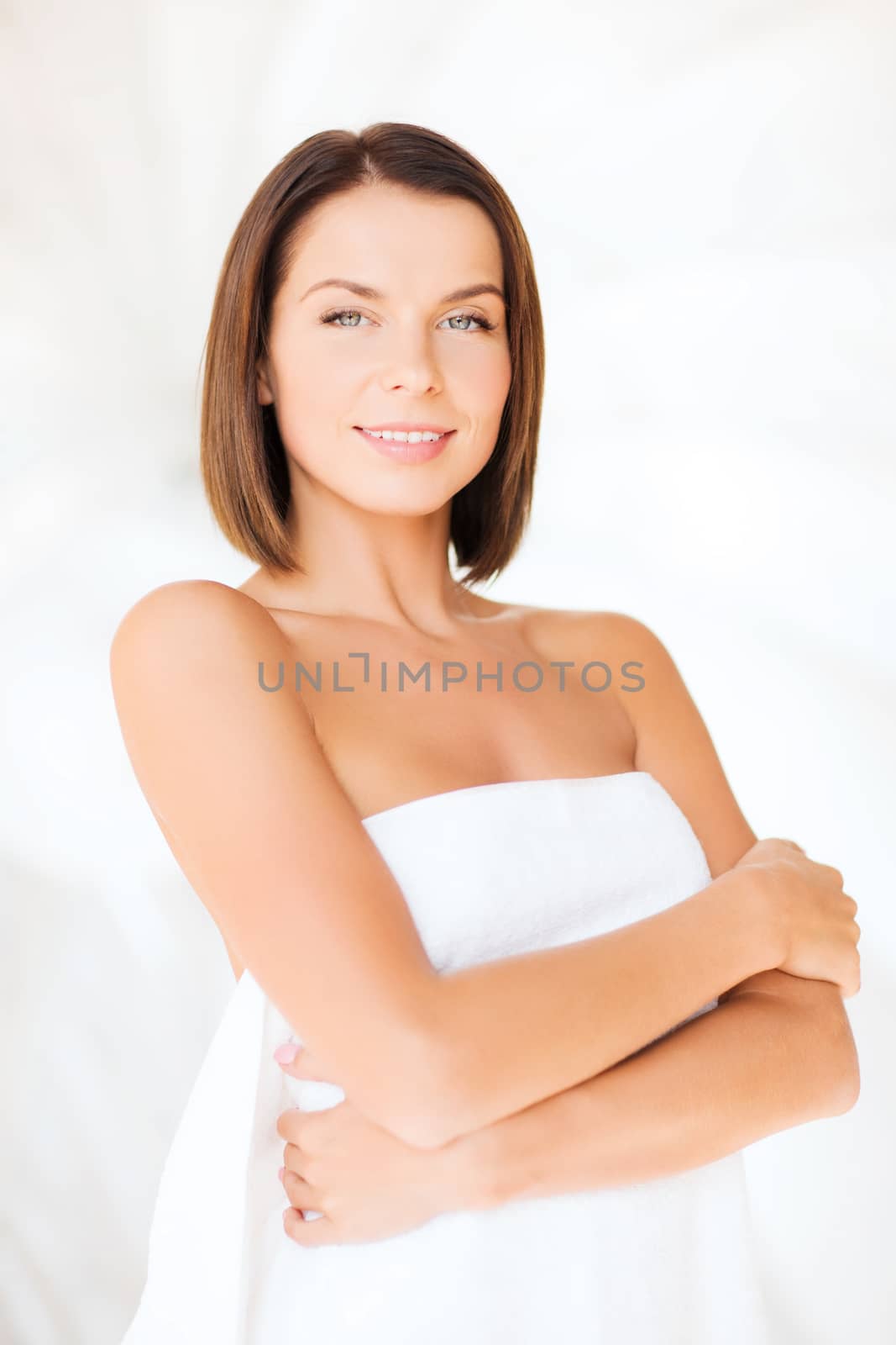 beautiful woman standing in towel by dolgachov