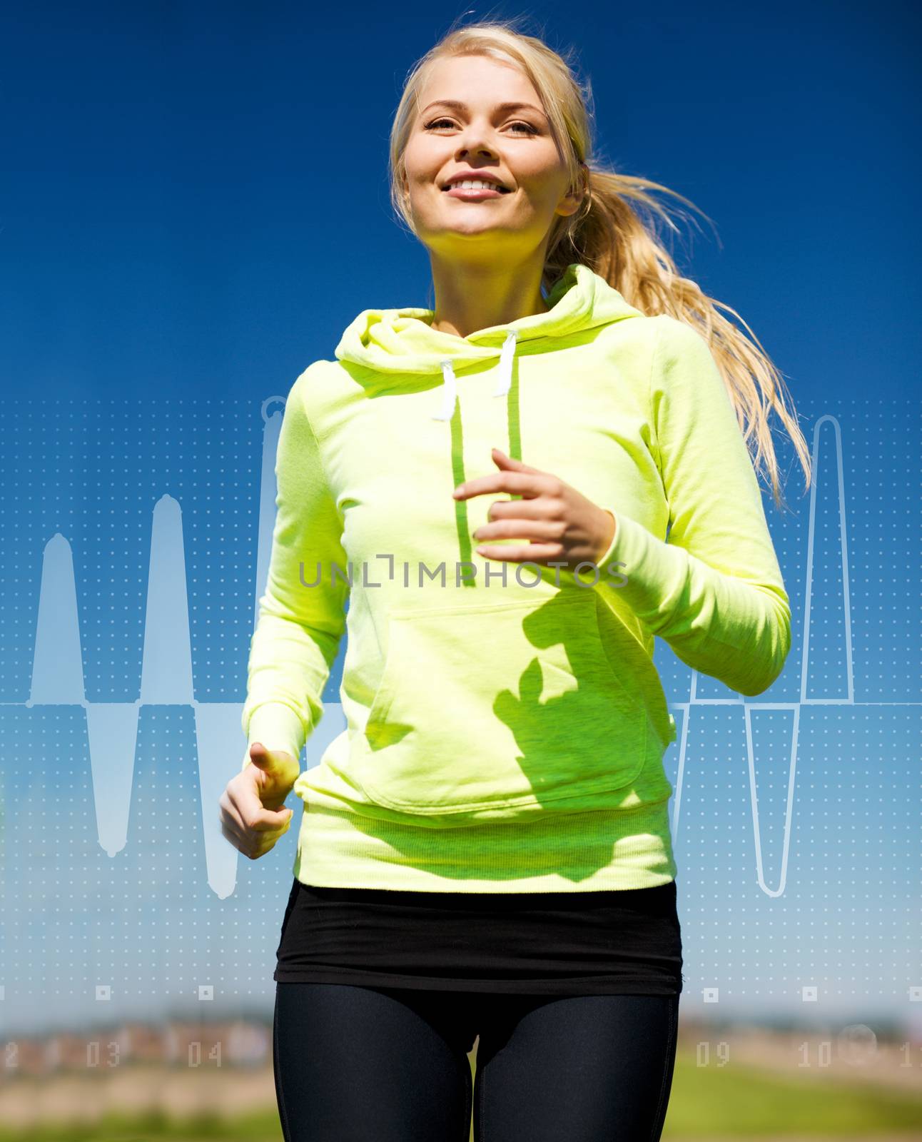 fitness, sport, training and lifestyle concept - smiling female runner jogging outdoors