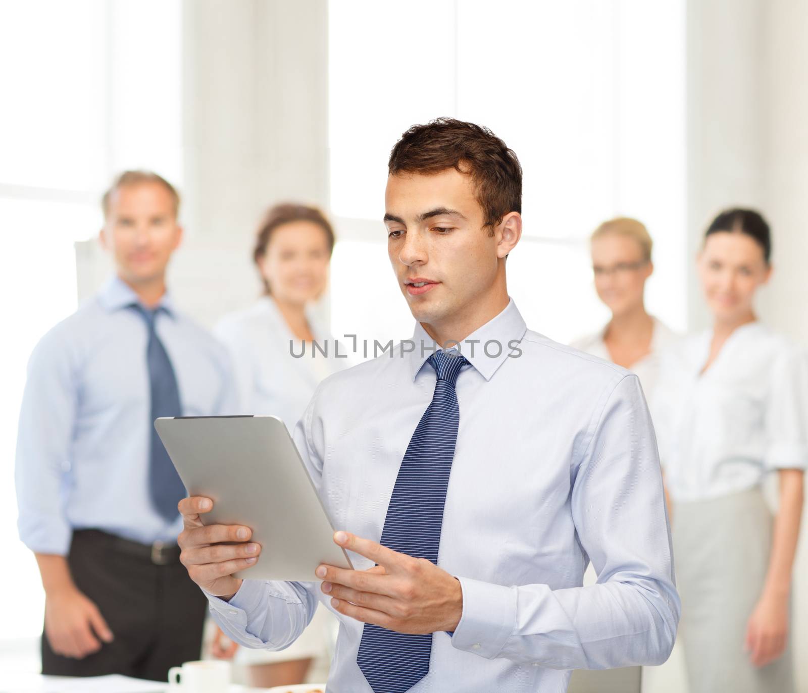 business, communication, modern technology and office concept - buisnessman with tablet pc