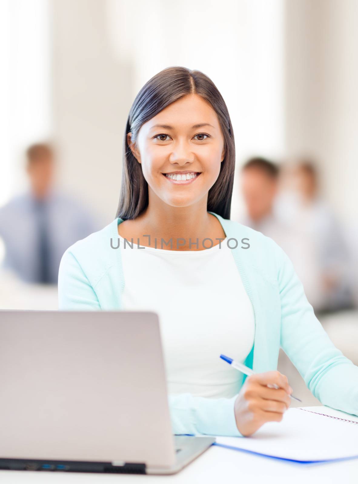 asian businesswoman with laptop and documents by dolgachov