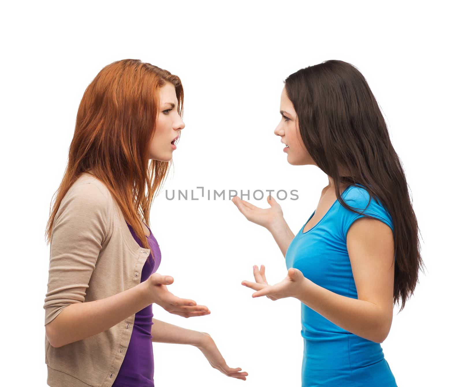 bullying, friendship and people concept - two teenagers having a fight