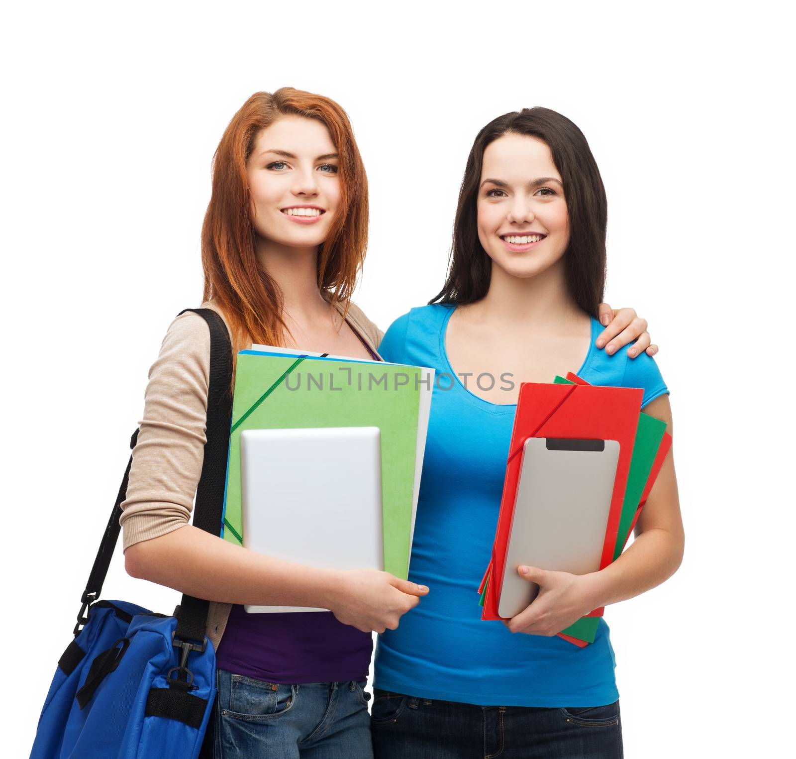 two smiling students with bag, folders and tablet by dolgachov
