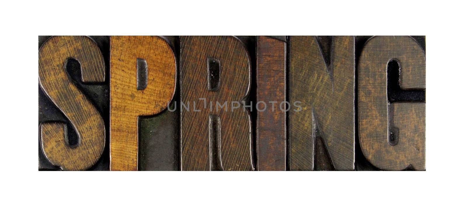 The word SPRING written in vintage letterpress type