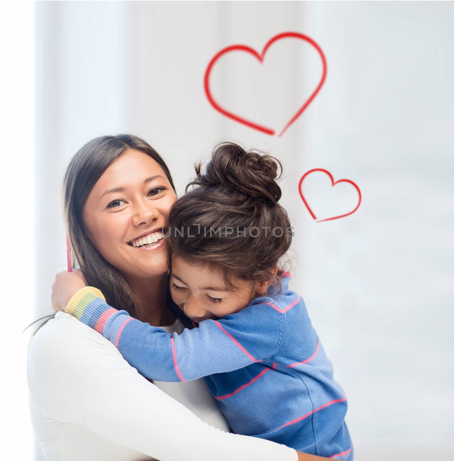 family, children and happy people concept - hugging mother and daughter