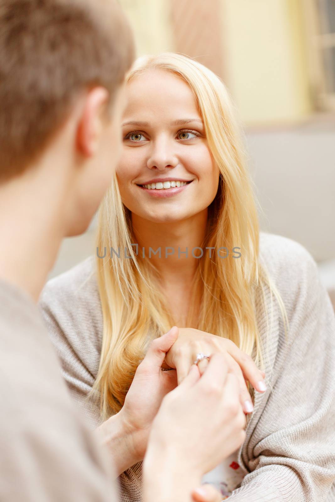 summer holidays, love, travel, tourism, relationship and dating concept - romantic man proposing to beautiful woman