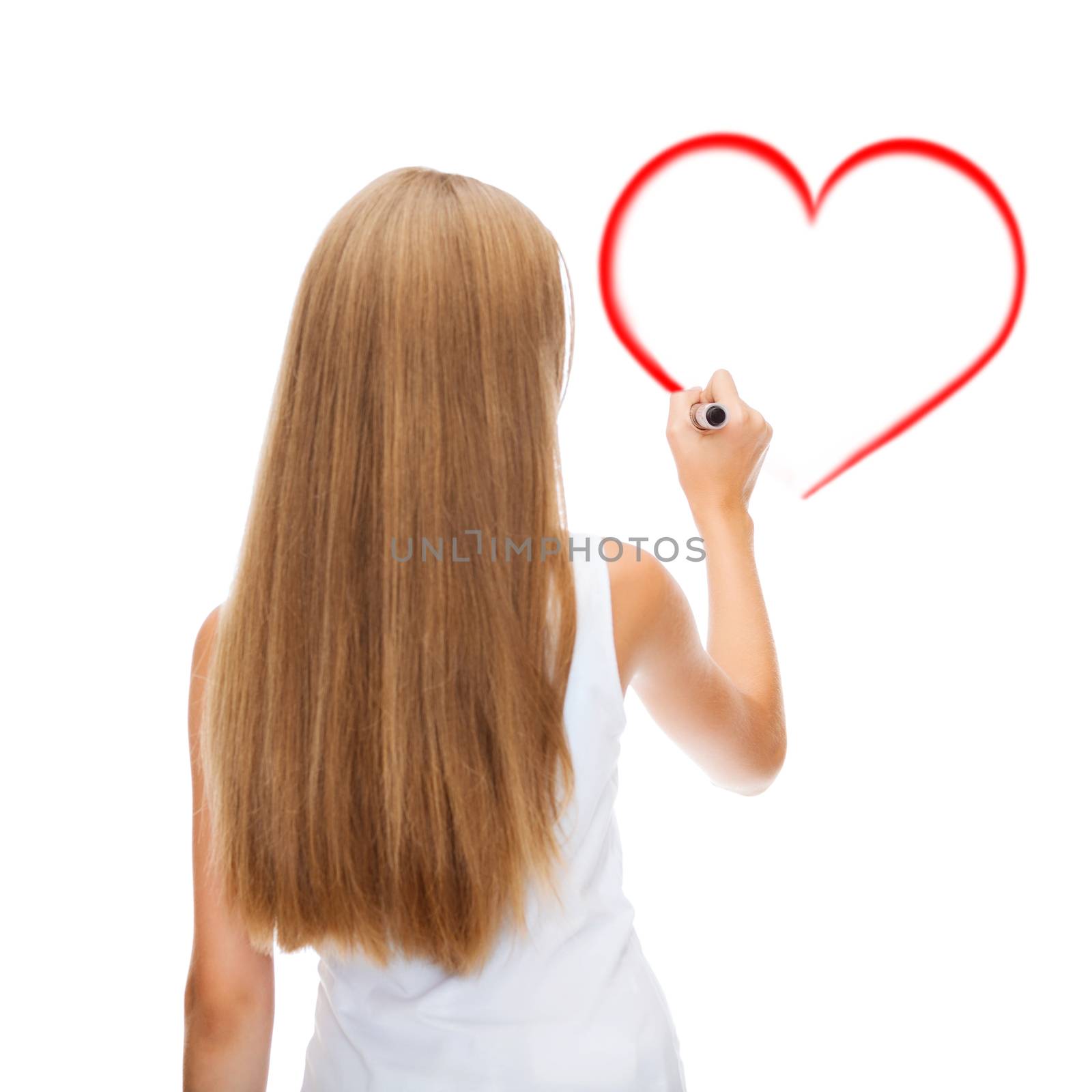 education, new technology and advertisement concept - teenage girl in white shirt from the back drawing heart on virtual screen