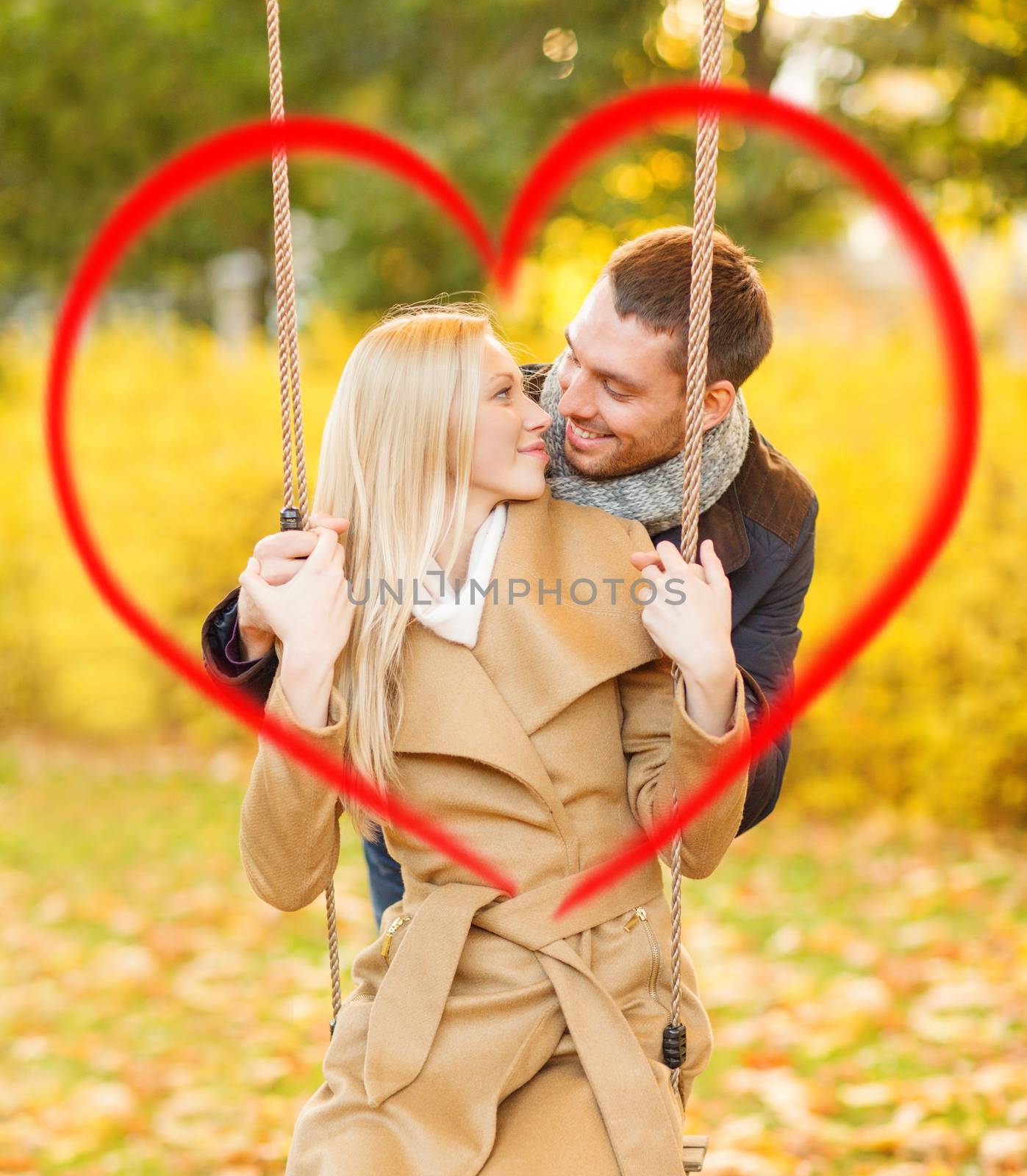 romantic couple in the autumn park by dolgachov