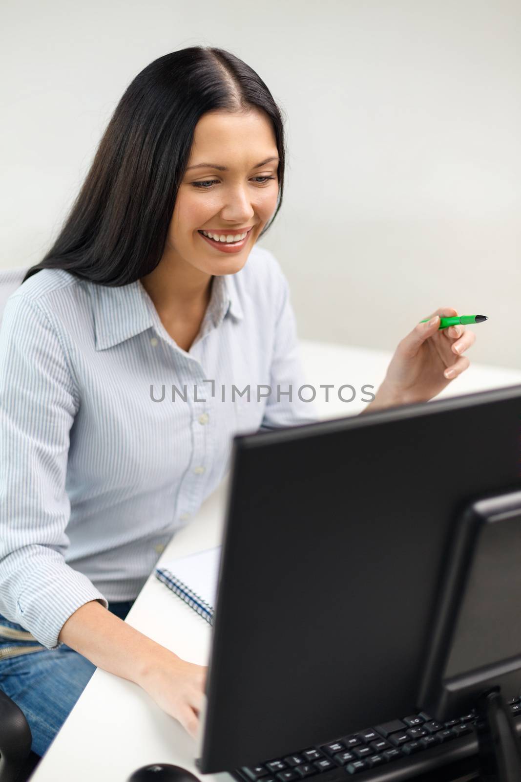 smiling businesswoman or student studying by dolgachov