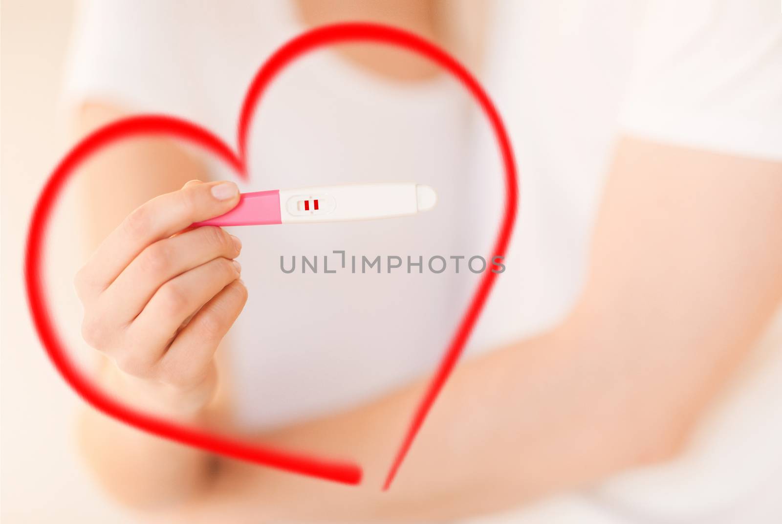 woman and man hands with pregnancy test by dolgachov