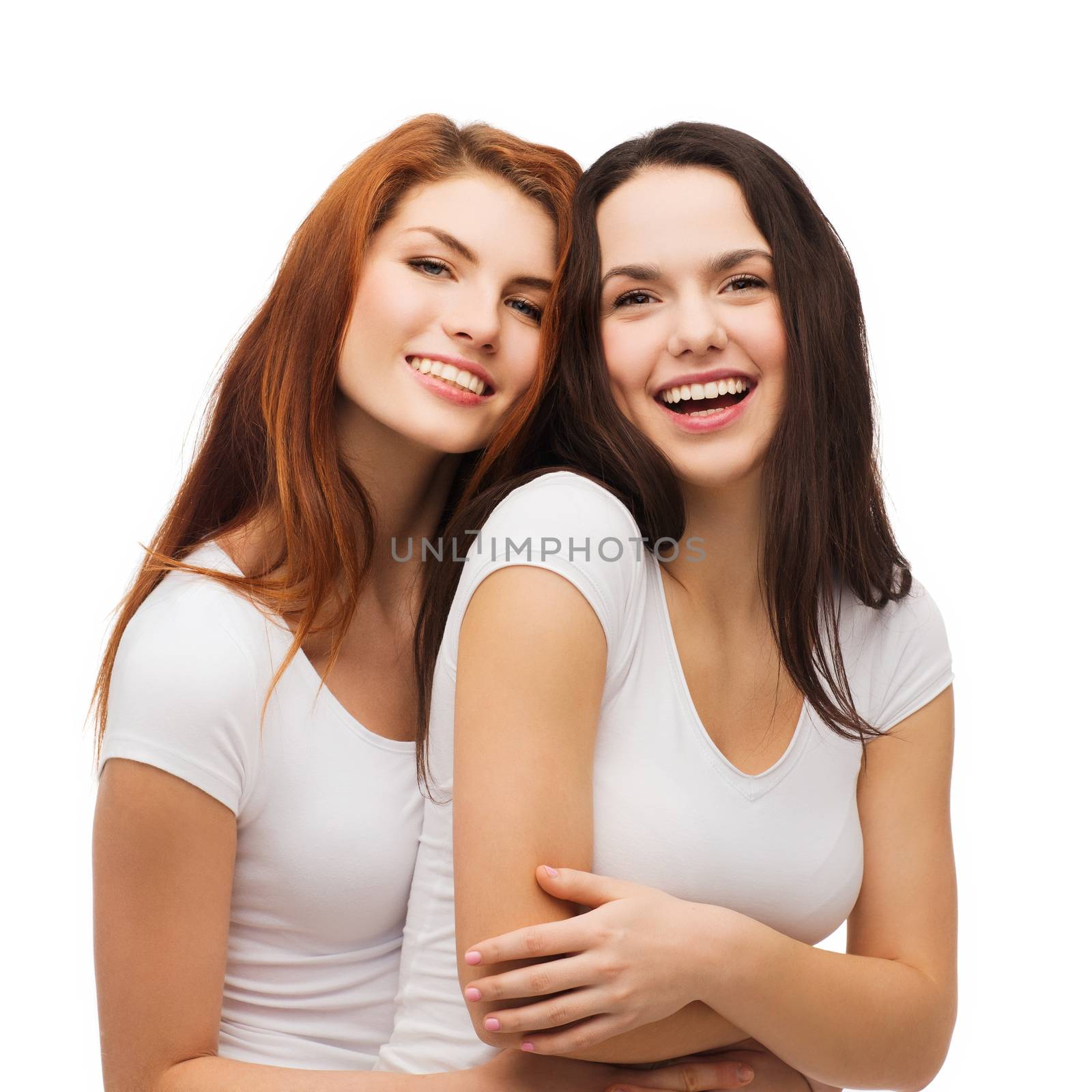two laughing girls in white t-shirts hugging by dolgachov