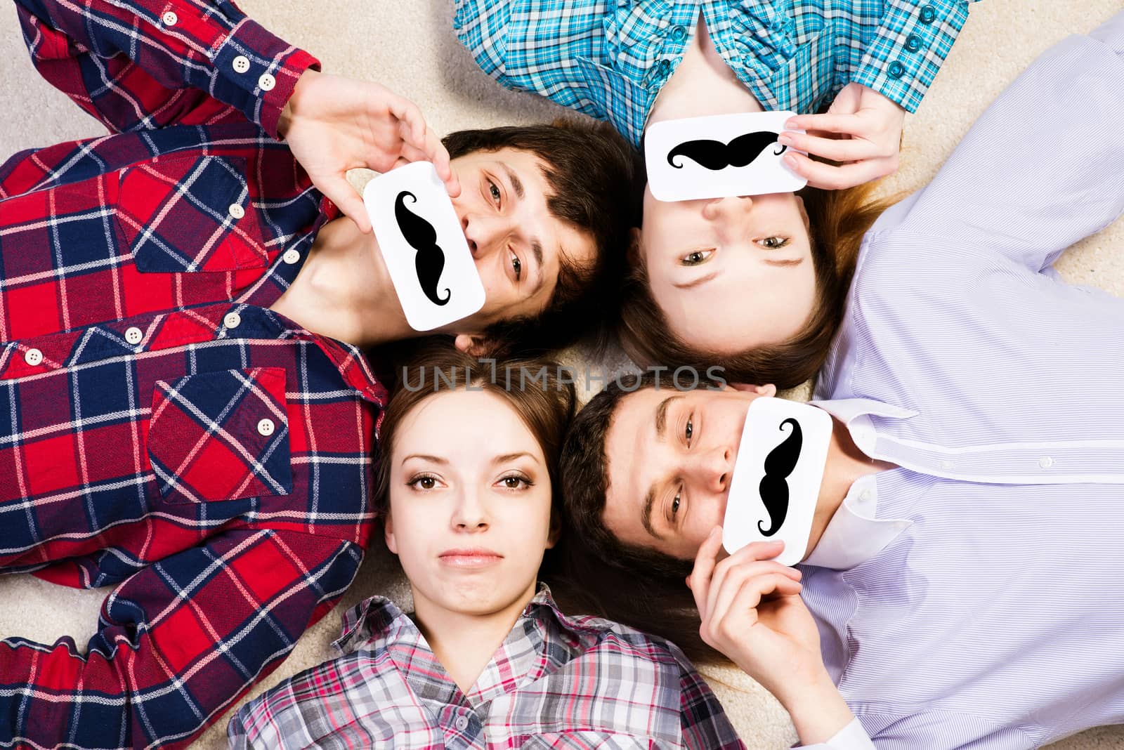 four young men lie together, applied to the face plate with a mustache