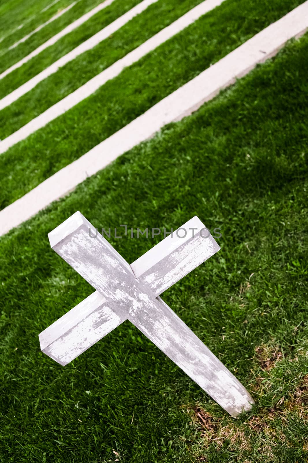 Lonely White Cross in a Old Cemetery