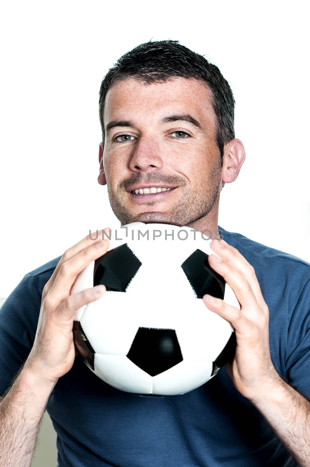 closeup of passionate soccer player with white and black balloon